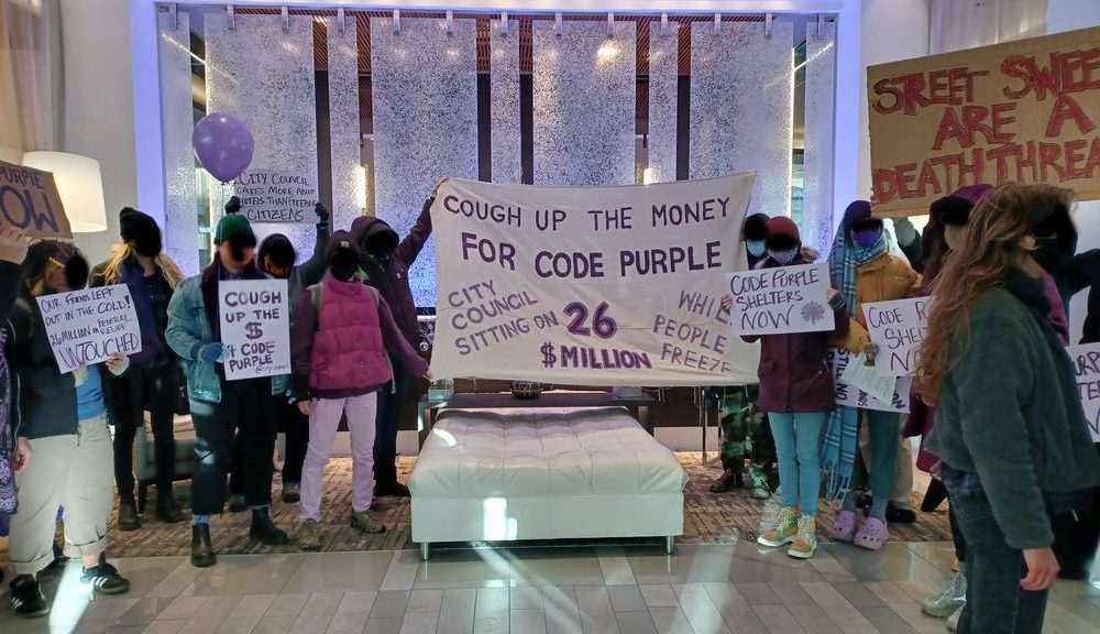 Housing activists occupying the lobby of Downtown Asheville's AC Hotel - Photo by Elliot Patterson (permission of Asheville Free Press)