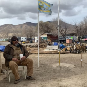 JJ Ayers sitting in front of a tent on WIC in 2021